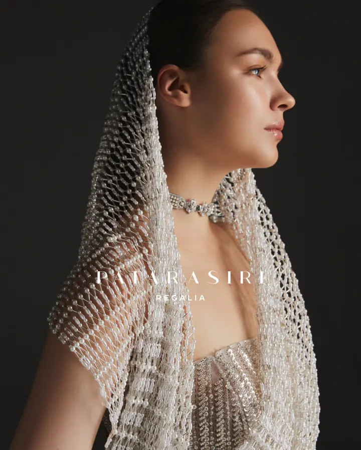 Patarasiri Regalia: a hood of hand-beaded pearl latticework over a crystal bodice